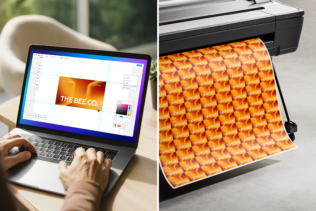 Designing business cards on a laptop next to printed card sheets