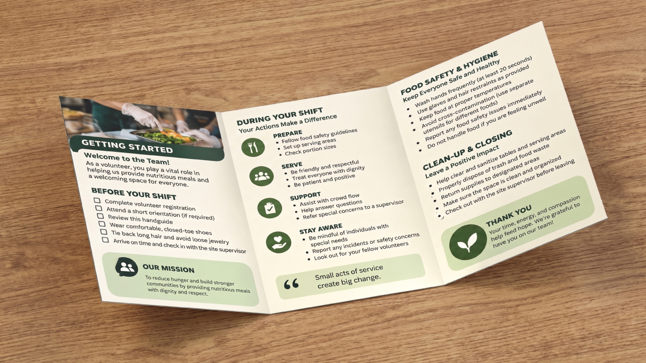 Tri-fold volunteer training guide brochure lying flat on a wooden surface