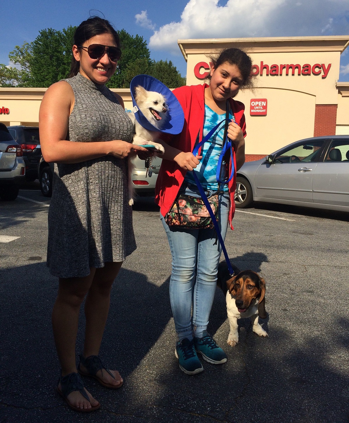 Two women with pet dogs