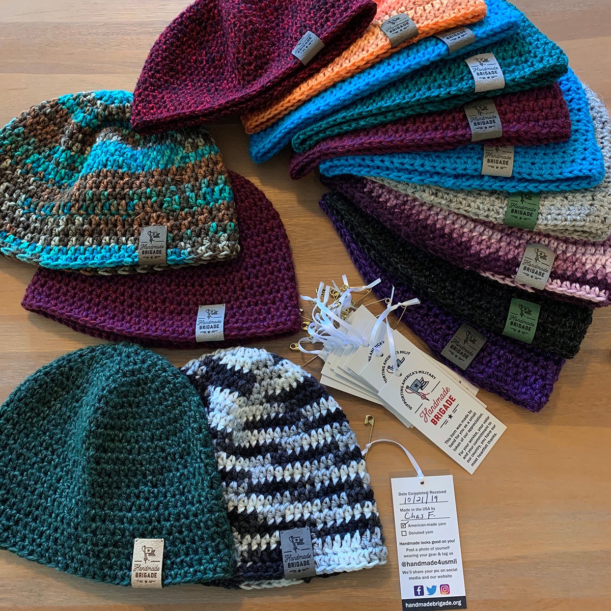 Knitted hats by Handmade Brigade with hang tags 