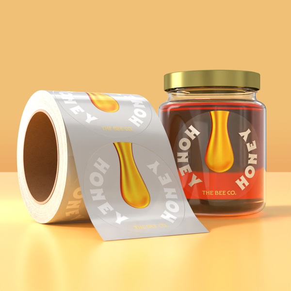 Honey jar with custom product label and label roll