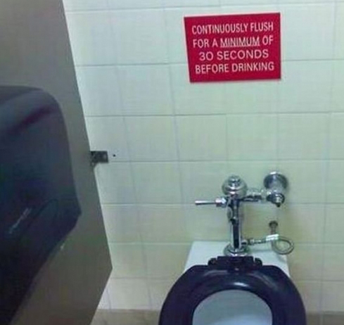Humorous bathroom sign instructing to flush for 30 seconds before drinking