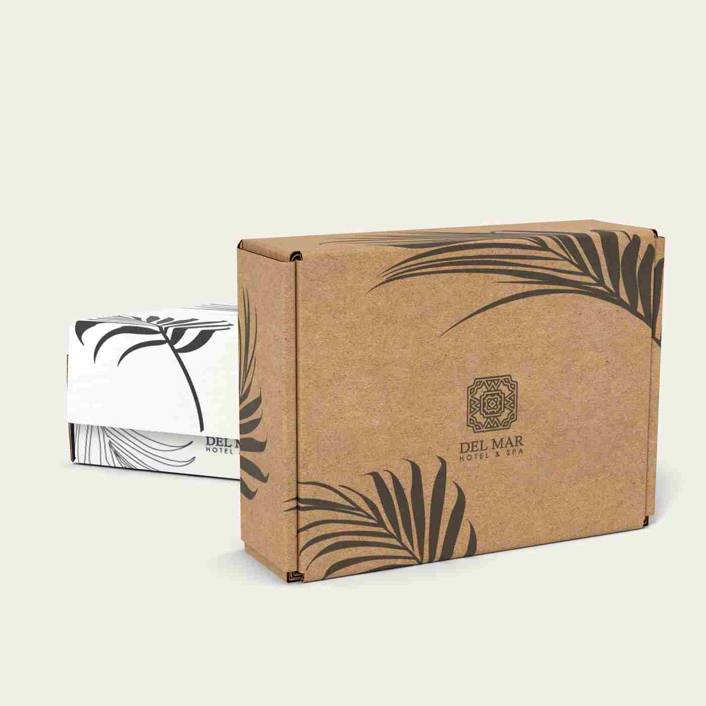 Closed kraft brown mailer box with black botanical prints
