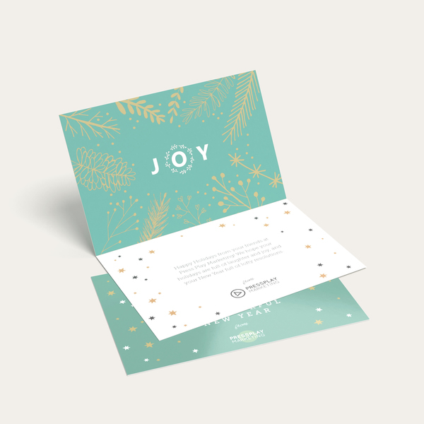 Folded greeting card with festive holiday-themed design and printed message