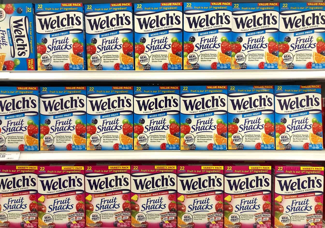 Rows of Welch’s fruit snacks boxes arranged on grocery store shelves