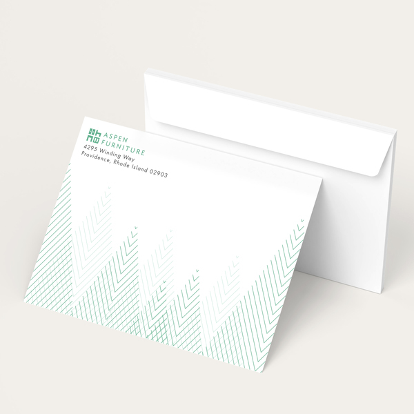 Custom printed envelope and matching stationery with a minimalist geometric design