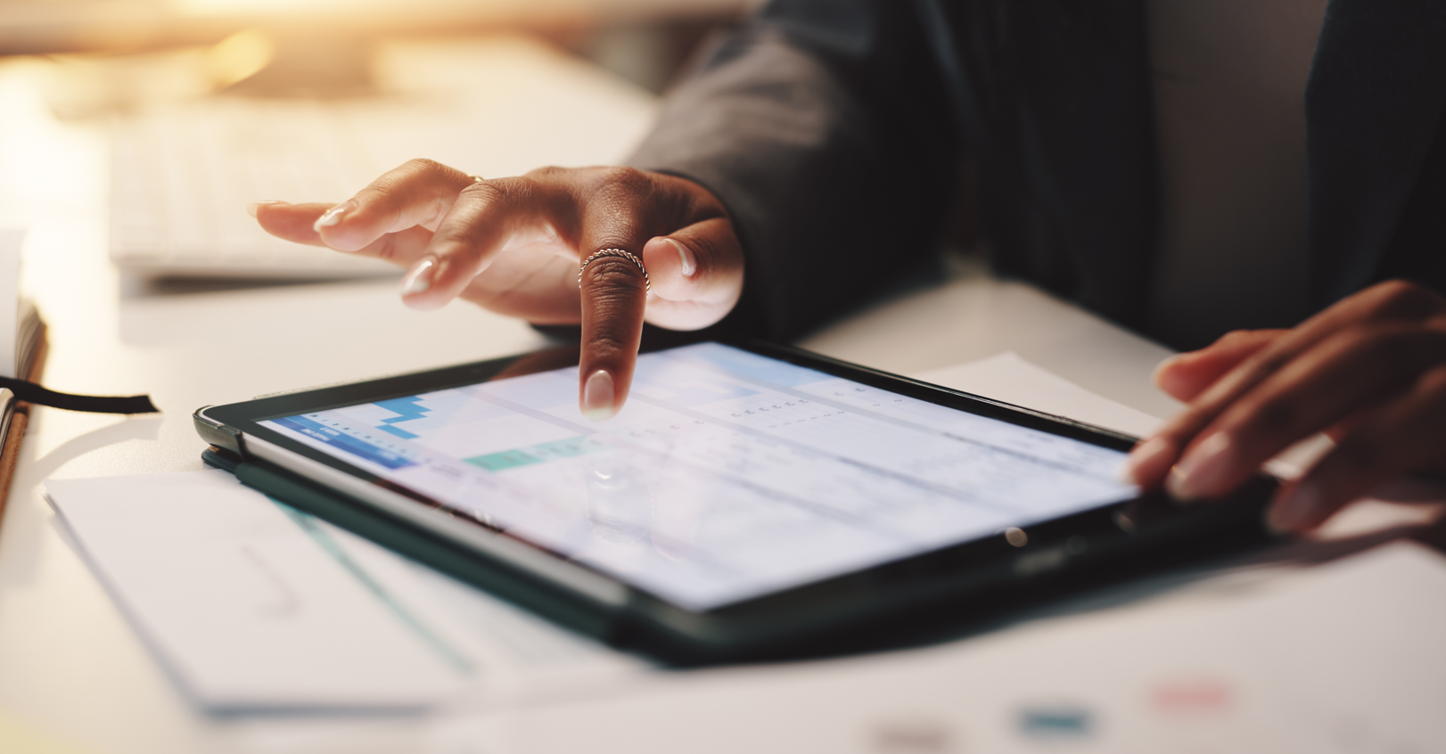 Person using a tablet for trade show budgeting