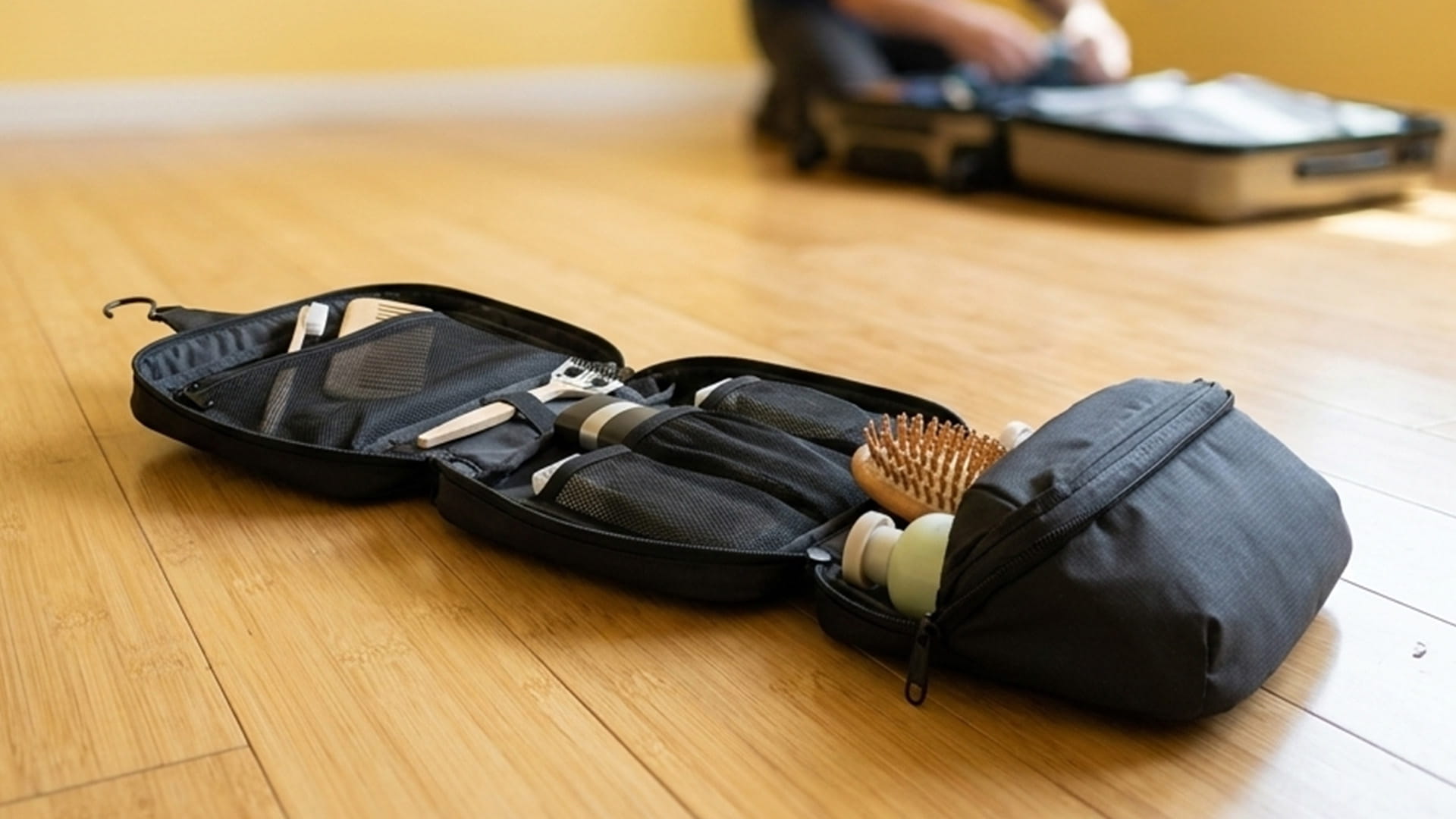 A rolled trifold travel storage kit placed on a wooden surface
