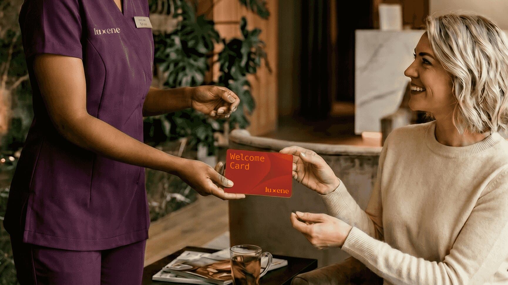 Employee handing card to woman.