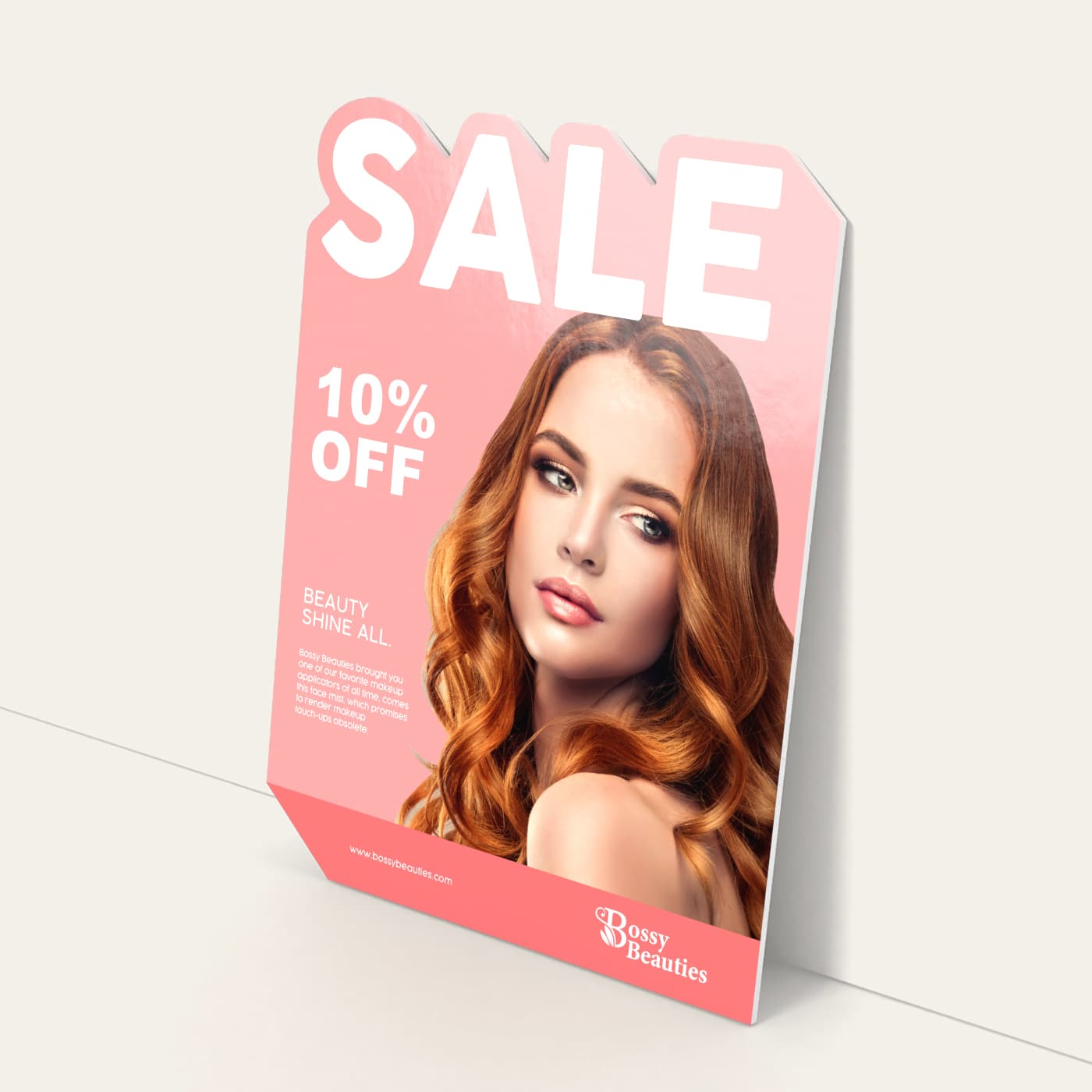 A freestanding salon promotional sign advertising a sale