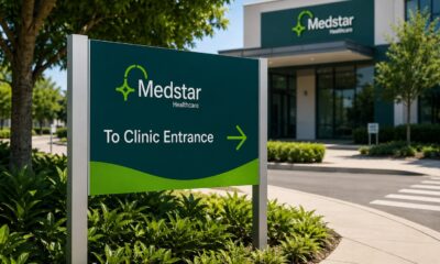 a metal sign going to a medical clinic
