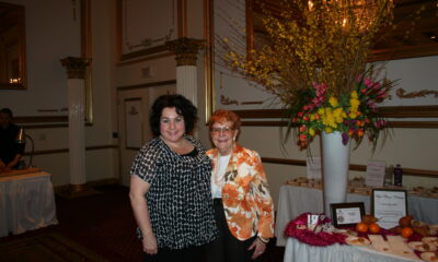 beautiful women mother and daughter at an event smiling