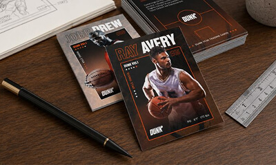 Custom basketball trading cards scattered on a desk