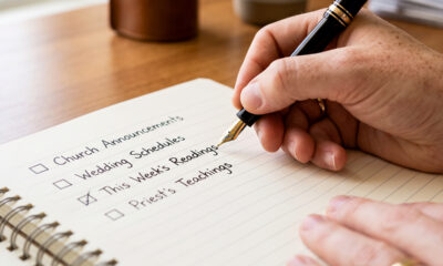 someone writing on his notebook