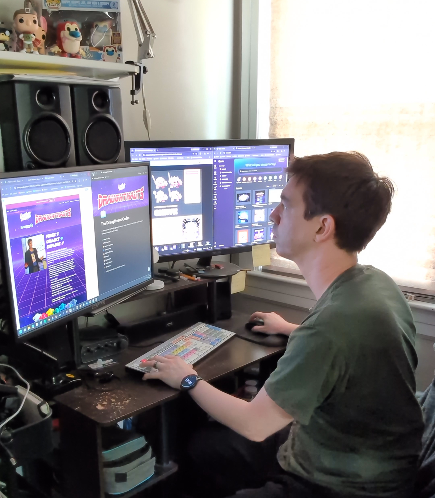 man sitting at a desk in front of a computer