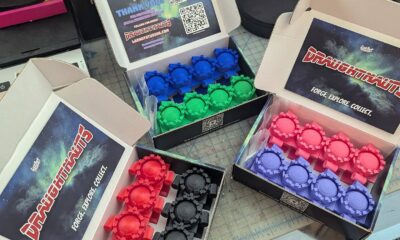 open boxes on a table with colorful contents inside